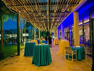 Lit terrace dinner set with event décor